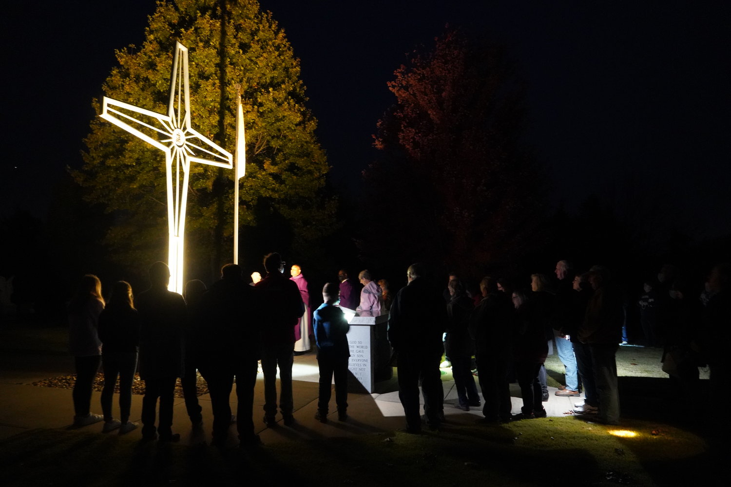 Father Roberto Ike, pastor of St. Andrew Parish in Holts Summit, leads a Rosary Procession from St. Andrew Church to the parish cemetery the evening of Nov. 2, All Souls Day.